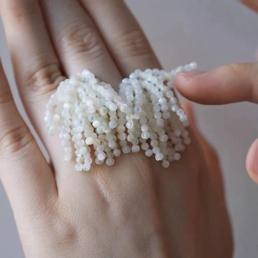 And Luxurious White Moon Tassel Earrings gallery 2