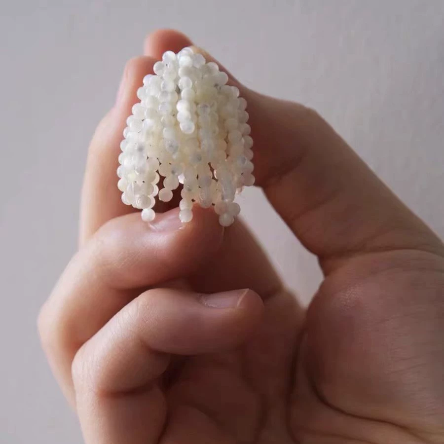 And Luxurious White Moon Tassel Earrings gallery 3